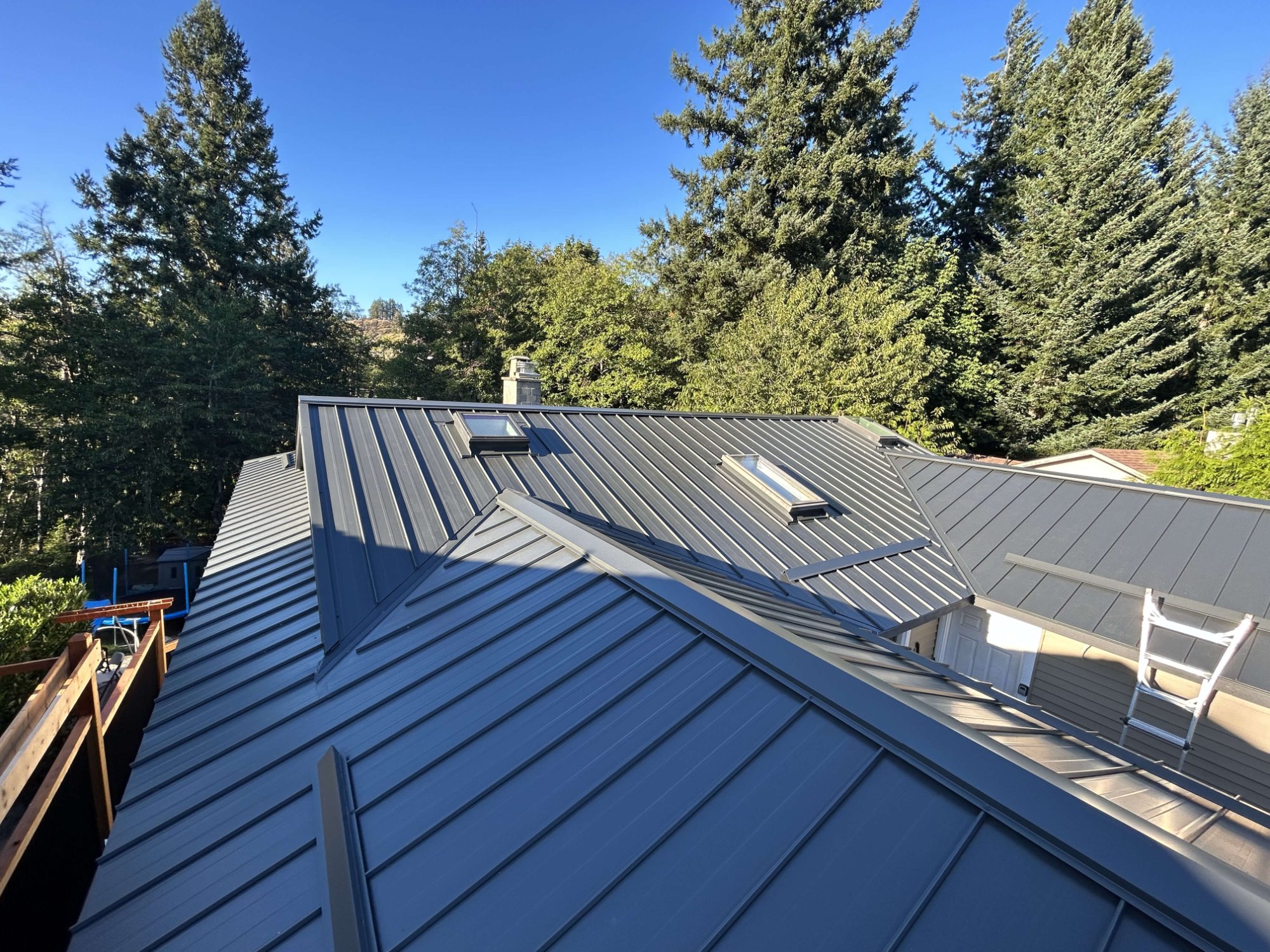 Completed standing seam metal roof installation by Shift